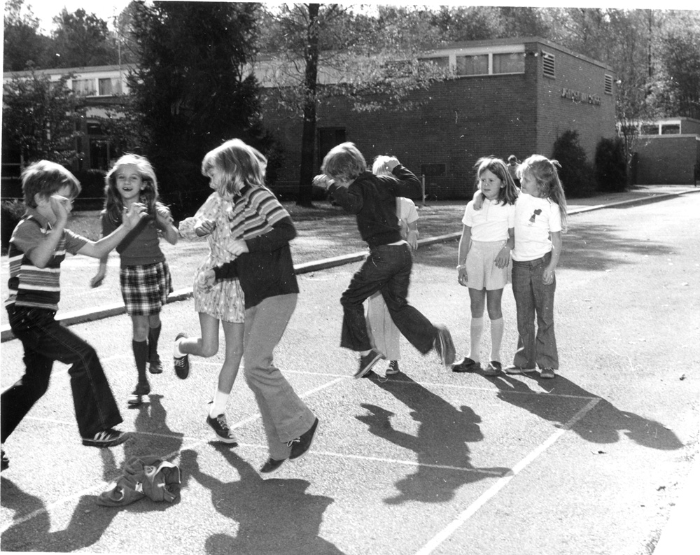 Students playing four square outside. Johnson Park Archives.