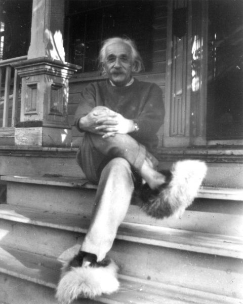 Albert Einstein sits on the porch of his home at 112 Mercer Street